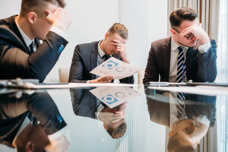 business failure. prospective bankruptcy. stressed stunned crushed defeated team of company...