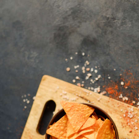 tortilla nacho chips food background. salty spicy crunchy slices in a bowl. copyspace conceptの写真素材
