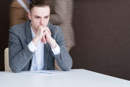 thoughtful serious business man. pensive office worker. thinking process contemplation conceptの写真素材
