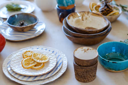 handmade crockery. handicraft pottery. artisan clay plates bowls cups and mugs assortmentの写真素材