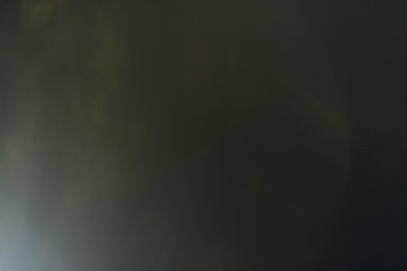 blurred glowing light. lens flare. soft shine dark background