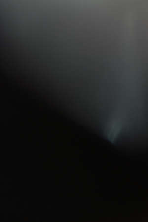 lens flare. glowing grey light. flash effect. abstract minimalistic backgroundの写真素材