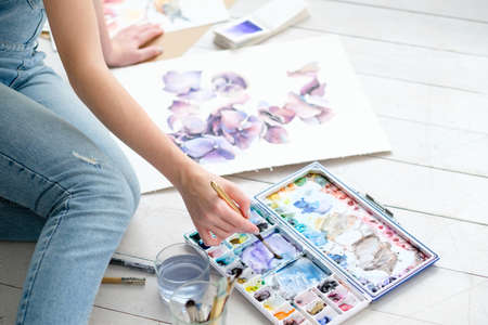 creative leisure. painting hobby. artful personality. talented girl drawing a pictureの写真素材