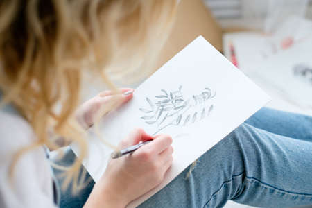 creative leisure. painting hobby. artful personality. talented girl drawing a pictureの写真素材