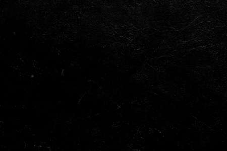 abstract art black textured background. distressed dark scratched design. plaster stucco effect. free space conceptの写真素材