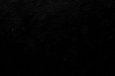abstract design black textured background. distressed dark scratched weathered backdrop. copy space conceptの写真素材