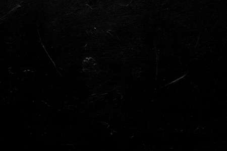abstract art black textured background. distressed dark scratched design. plaster stucco effect. free space conceptの写真素材