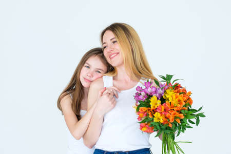 flower bouquet gift on mothers or womens day. tender floral alstroemeria composition. loving mom and daughter family relationshipの写真素材