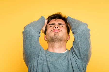Devastated stricken man in despair. failure and loss concept. portrait of a young brunet guy on...