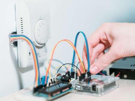 smart home system development. engineer checking components before installing automated house control systemの写真素材