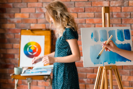 painting art classes. drawings creation. learning to dilute watercolor. teacher and student...