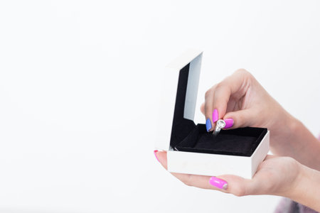 special female jewelry gift. luxury presents and reward concept. woman holding a box with a diamond...