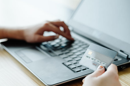 online money loan. financial operations on the internet. woman typing her bank card data on the...