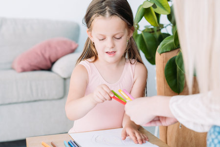 child drawing hobby. artful kids leisure. little girl choosing a pencil to express her imagination...