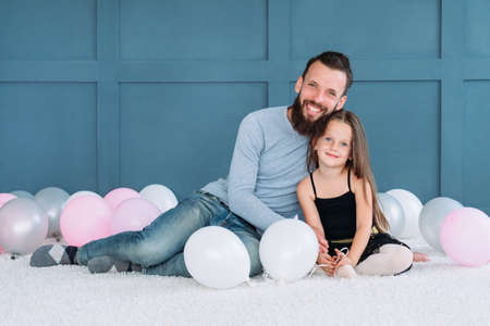 family bond. loving dad hugging his daughter. happy smiling father and child. healthy family relationship and responsible fatherhood.の写真素材