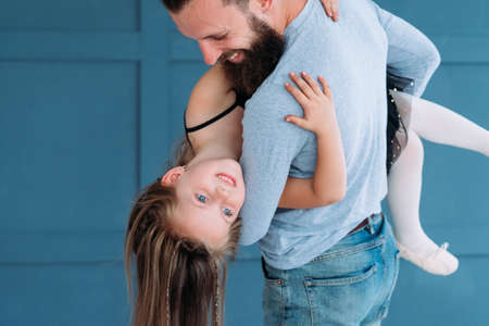 playful family leisure. father love expression. dad holding his little girl in his hands. cute child laughing. joy happiness and fun moments.の写真素材