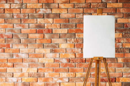 drawing lessons. art classes. painting school. learn to create pictures. blank canvas or watercolor paper on easel. empty space for advertisement.の写真素材