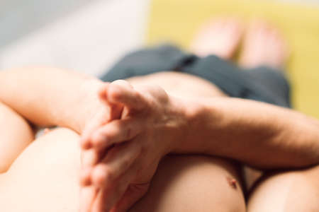 yoga. healthy mind and fit body. physical training routine. sport and stamina. unrecognizable man holding his hands in anjali mudra preparing to exercise. namaste gesture.の写真素材