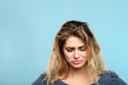 crying tearful stressed woman. portrait of a sad gloomy depressed sorrowful melancholy young girl on...