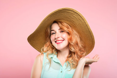 summer holidays and touring trips concept. young pretty woman in a big sunhat ready to go to the...