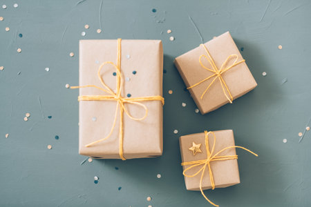 presents wrapping and packaging. holiday traditions and handcraft. three gift boxes in craft paper...