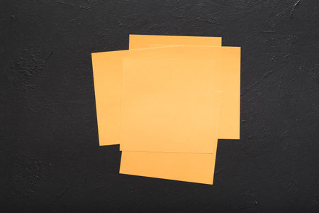 blank reminder notes on black background. message news planning ideas concept. copy space