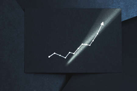 exponential graph. growth breakthrough success concept. arrow pointing upward on black paper.