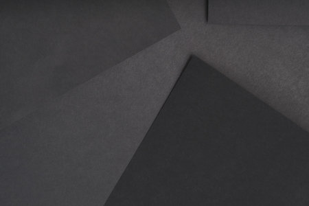 paper layers. abstract geometric background with copy space. monochrome black sheets collage.
