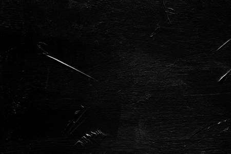 scratches and texture effect on black background. weathered layer for photo editor design.の写真素材