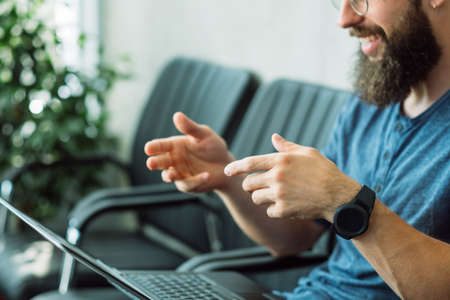 online job interview. man talking to hr laptop through video callの写真素材