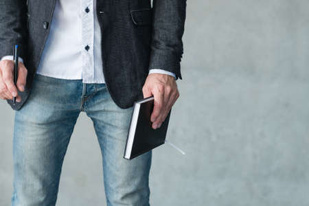 man holding notebook and pen. business plan and strategy development.の写真素材