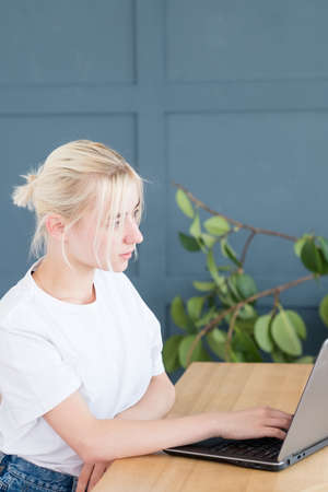 self employed woman typing on laptop. freelance work or remote job.