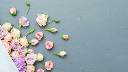 Fresh flower composition. Anniversary concept. Copy space on grey background. Flat lay.の写真素材