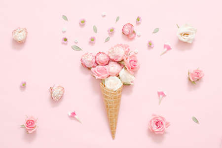 Spring holiday present. Conceptual rose bouquet on festive pink background.の写真素材