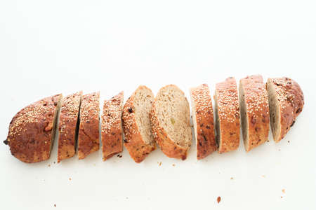Wholegrain bread sliced. Restaurant serving. Fresh bakery simple composition.の写真素材