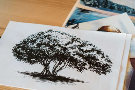 Painter artwork. Artist studio workplace. Black and white watercolor paintings of tree.