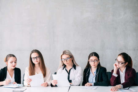 Job opening. Corporate committee. Recruitment team selecting employees. Copy space on grey background.の写真素材