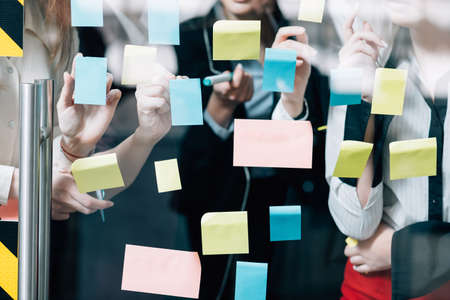 Business teamwork. Brainstorming collaboration. Corporate female group developing creative strategy.の写真素材