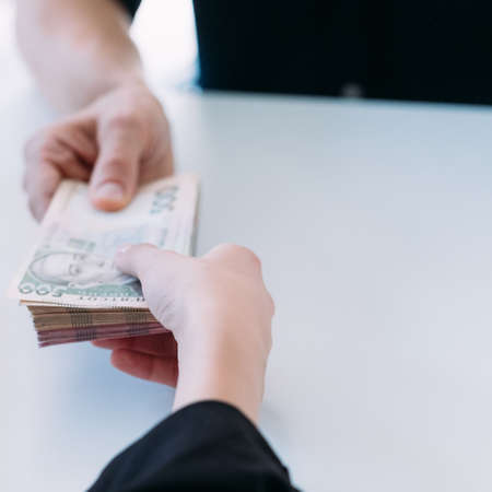 Cash money stack. Bribery and corruption. Batch of 500 ukrainian hryvnia bills.の写真素材