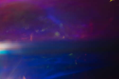 Soft defocused purple dark blue background. Outer space concept. Lens flare blur.