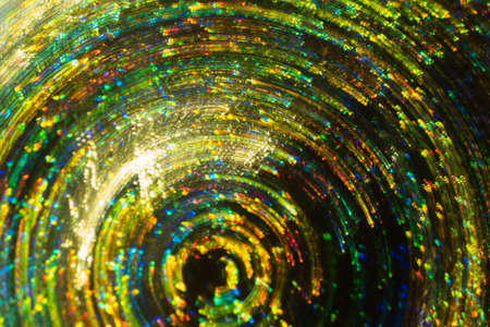 Neon lights on dark background. Whirling multicolor vortex. Defocused blurred lines. Lens flare.