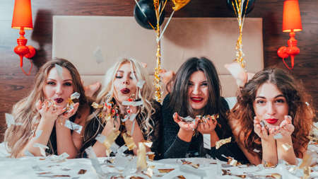 BFF hangout. Urban girls leisure and lifestyle. Glitter confetti decor. Friendship. Young women in...