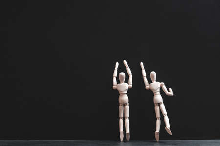 Reach for stars. Hope, wish and aspiration. Cooperation and creativity. Conceptual articulated mannequin composition.の写真素材