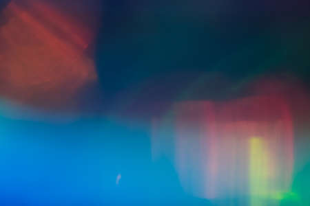 Lens flare multicolor background. Defocused gradient concept. Blurry night city lights.の写真素材