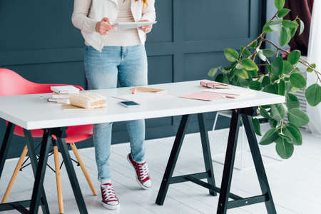 SMM expert workplace. Tablet data in hands. Target audience likes. Followers increase. Successful...
