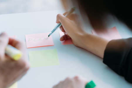 Business strategy planing, design and management. Corporate team working on project. Brainstorming, discussion, writing notes.の写真素材