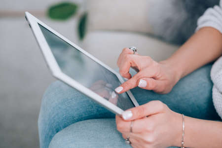 Tablet in woman hands. Technology, internet and networking. Digital communication. Modern personal...