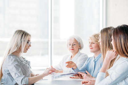 Successful business women. Job interview at female oriented company. Qualification test. Ambitious candidate applying position.の写真素材
