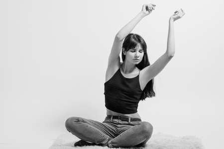 Relaxed lady. Carefree facial expression. Black and white full length portrait of emotional girl....