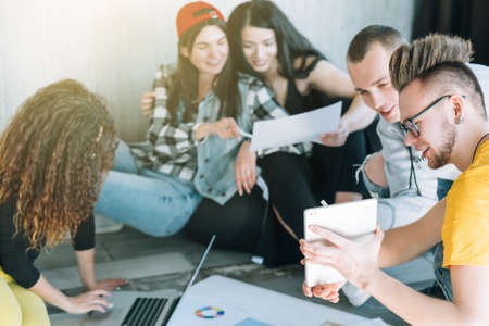 Millennial coworkers. Young creative team working together in casual atmosphere. Modern business...